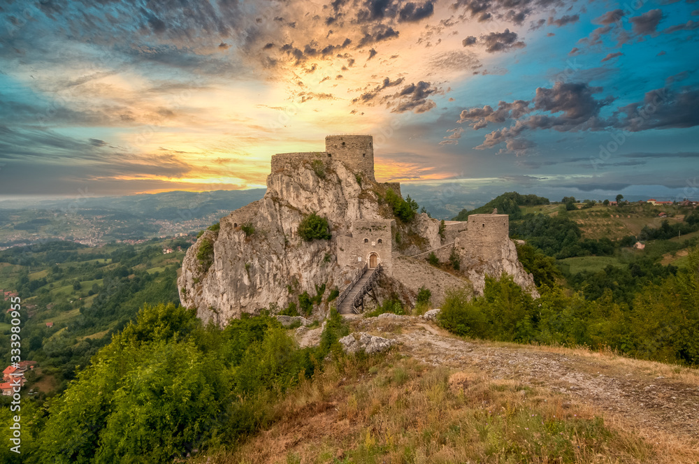 Medieval Srebrenik castle in the Bosnian Serbian republic Bosnia Herzegovina with dramatic sunset sky