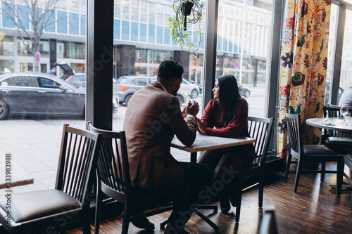 Young loving couple in cafe together. Love, family concept