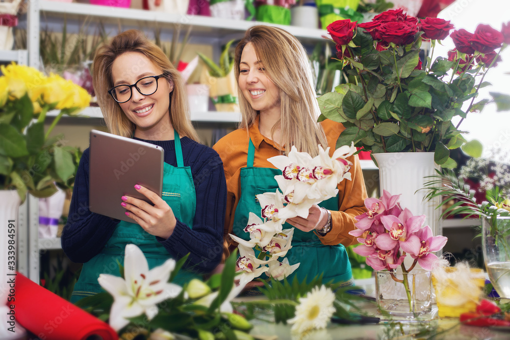 Two Young Woman Working with  Flower  in flower shop