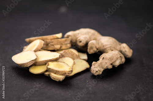 Portion of fresh Ginger (selective focus; close-up shot)