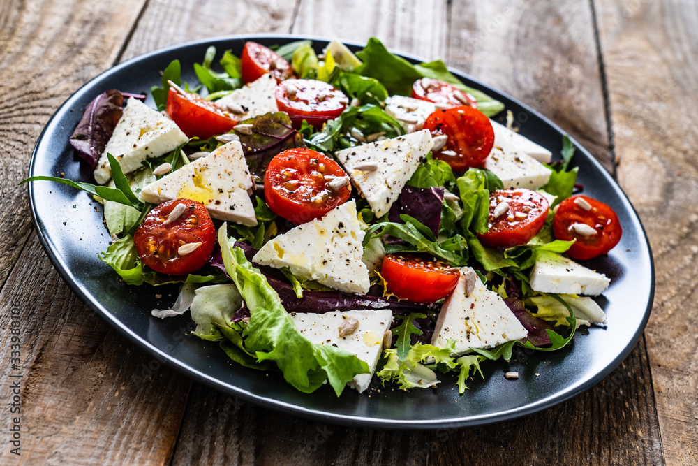 Fresh greek salad - feta cheese, tomato, lettuce, black olives and onion Fresh greek salad - feta cheese, tomato, lettuce, black olives and onion