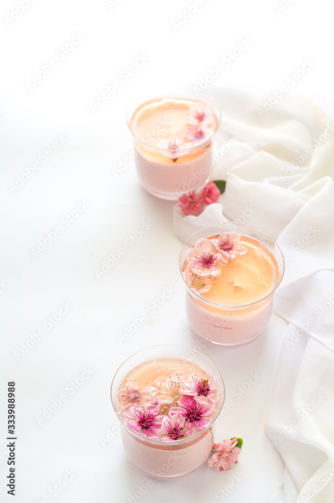 Peach jello and strawberry mousse. Pink. White background. Peach jello and strawberry mousse. Pink. White background.