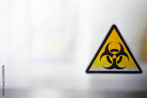 Quarantine. Quarantine warning sign on a glass door in a hospital isolator. Isolation of patients with the virus in special laboratories. Virus.