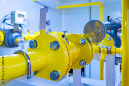 Gas industry. Yellow pipes in the enterprise. Natural gas supply. Gas distribution station equipment. Pipes on the background of the flowmeter. Accounting of natural resources.