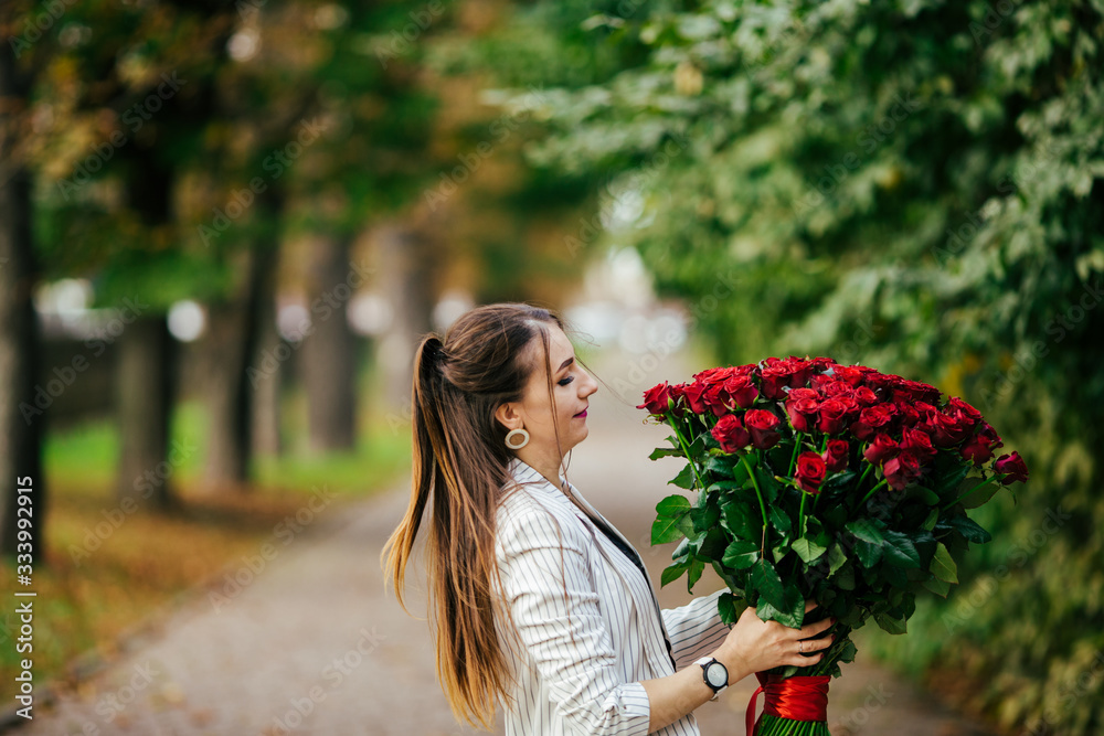 womans hand is holding a bouquet of flowers womans hand is holding a bouquet of flowers