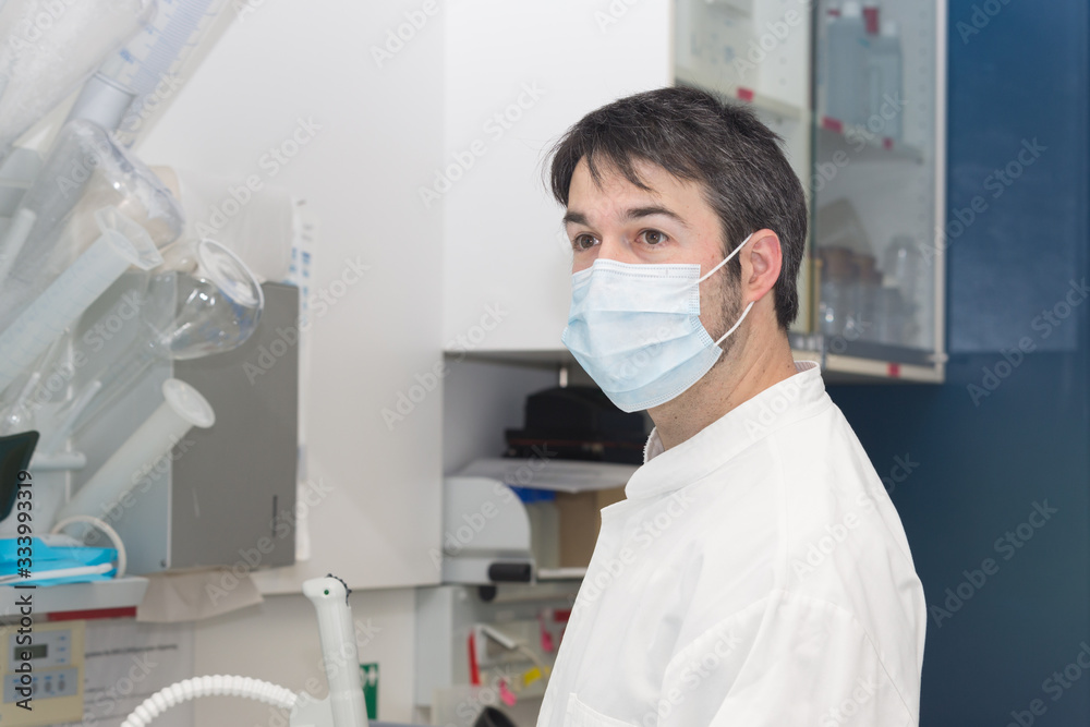 man wearing mouth mask at lab man wearing mouth mask at lab