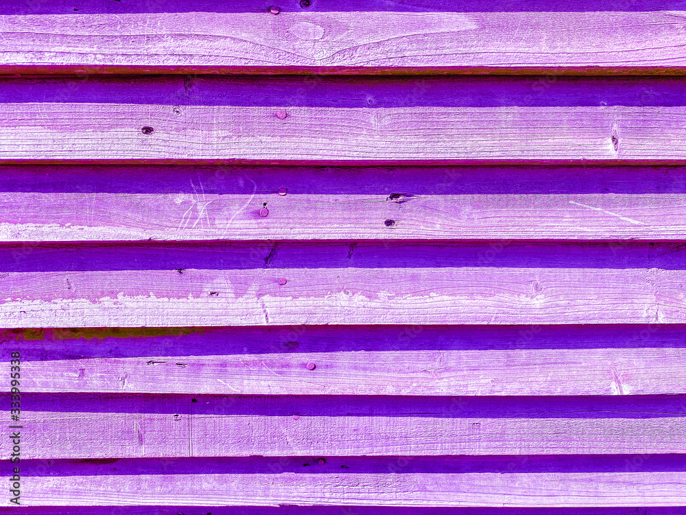 Close-up of an abstract wooden surface of purple color. Close-up of an abstract wooden surface of purple color.
