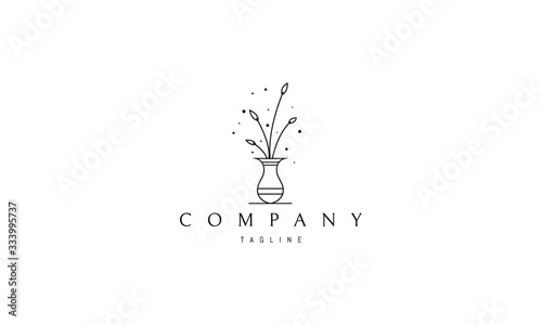 Vector logo on which an abstract image of an elegant vase with flowers.