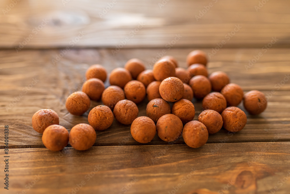 Carp baits on a wooden background. Carp baits on a wooden background.
