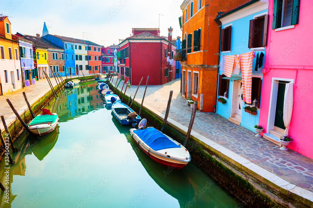 Colorful houses on the canal in Burano island, Venice, Italy. Famous travel destination