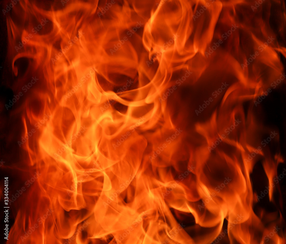 Close up hot fire flame burning glowing on black dark background. Fire concept, background. Selective focus. Close up hot fire flame burning glowing on black dark background. Fire concept, background. Selective focus.