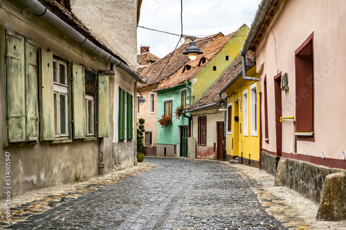 old street with colorful historic houses in Sibiu, Romania