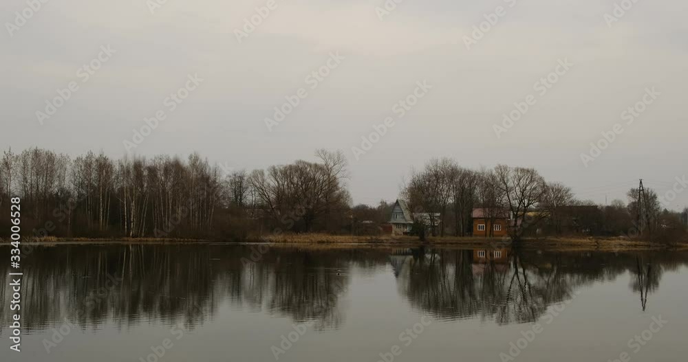 Small pond and old houses in the suburbs near Leningradskoye Shosse Small pond and old houses in the suburbs near Leningradskoye Shosse