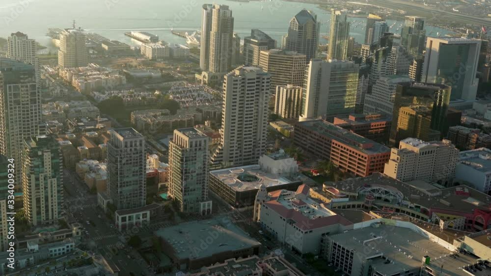 Aerial helicopter footage of the downtown San Diego skyline during a beautiful sunset. California, USA.