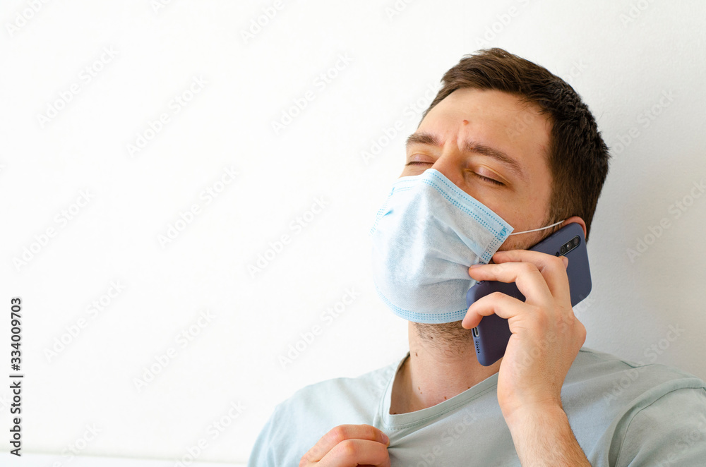 Coronavirus. Quarantine. A man calls a doctor. Fever, cough. Complaint about symptoms. Coronavirus. Quarantine. A man calls a doctor. Fever, cough. Complaint about symptoms.