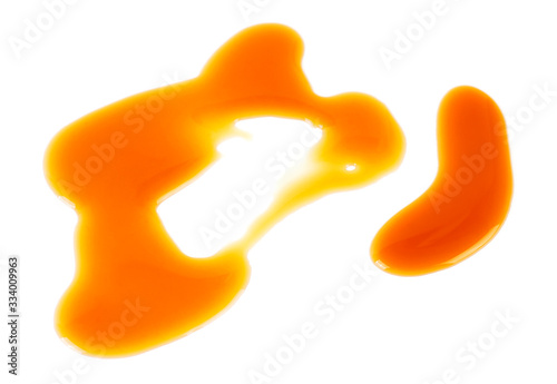 Sweet caramel sauce spot isolated on a white background. Golden Butterscotch toffee caramel.