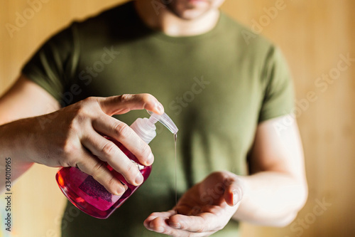 Wallpaper Mural A man applying antibacterial soap to his hands, close-up of a man's hands. Hand washing as prevention of infection of corvid-19 and coronavirus. The concept of personal hygiene Torontodigital.ca