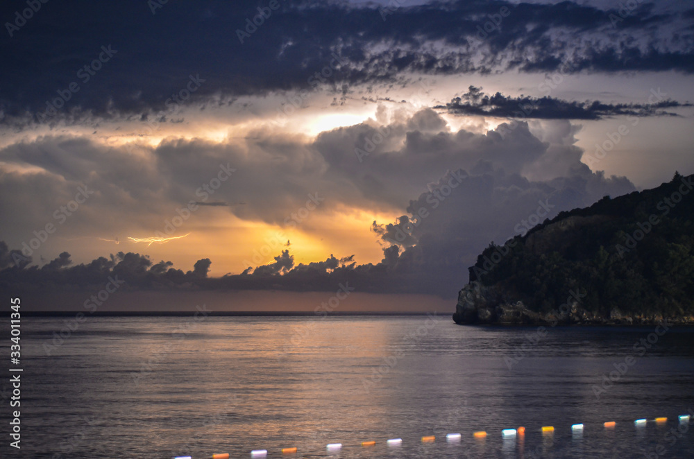 Fototapeta premium a beautiful sky above the sea rich in stars and lightning