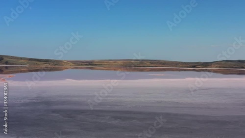 Aerial view of pink lake - Chokrak lake in Karalarsky park, Crimea, 4k photo