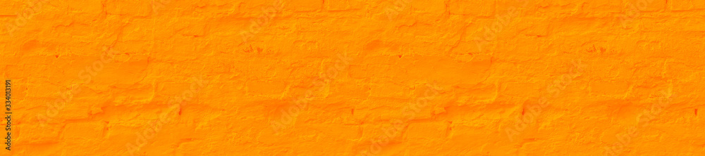 Panorama saffron plastered brick wall texture.