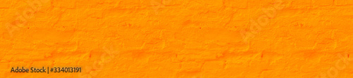 Panorama saffron plastered brick wall texture.