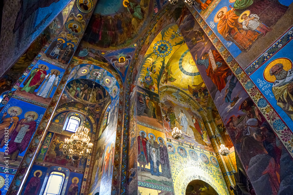 The colorful mosaic covered ceiling, walls and columns on the inside of the Church of Our Savior on Spilled Blood in Saint Petersburg, Russia the interior