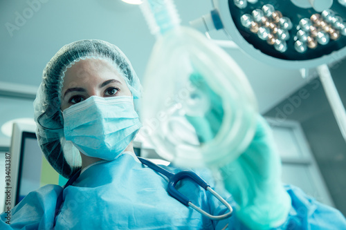 Experienced anesthesiologist doing her work stock photo photo