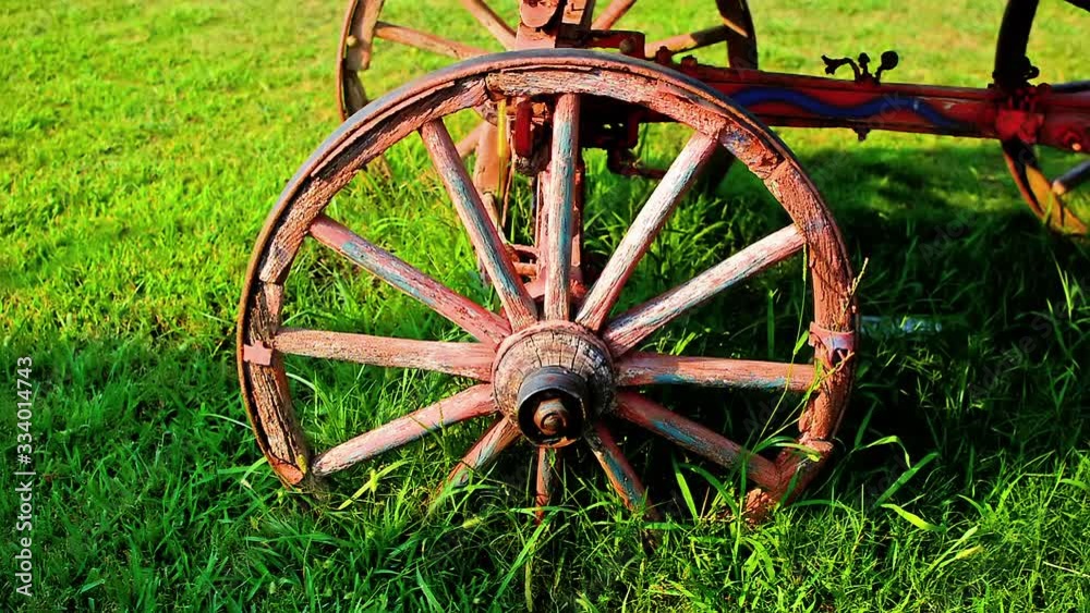 Old carriage wheel refurbished and located in the lawn. Old carriage wheel refurbished and located in the lawn.