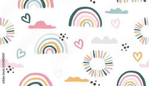 Seamless vector pattern with hand drawn rainbows and sun.