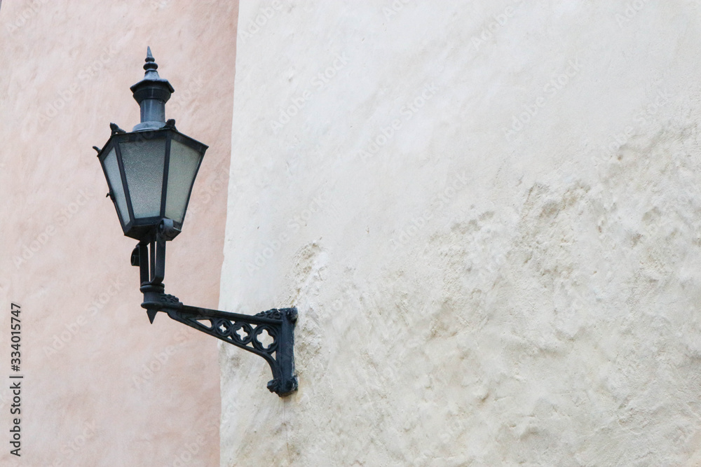 old street lamp on the medieval house wall old street lamp on the medieval house wall