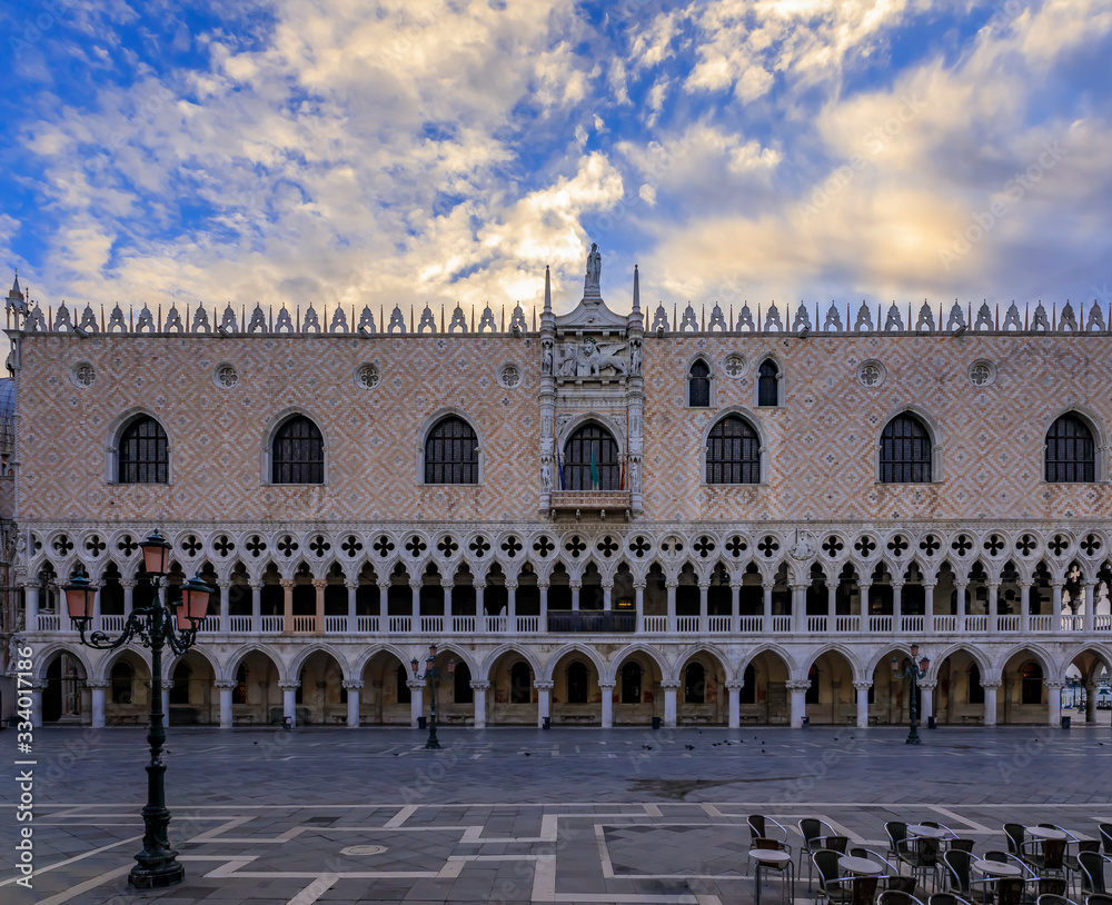 Ornate gothic facade of the famous Doge's Palace, symbol of Venice on St. mark's or San Marco square at sunrise, Italy