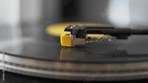 Close-up of retro turntable vinyl record player with music plate. Needle on a vinyl record. Concept of retro sound technology audio equipment