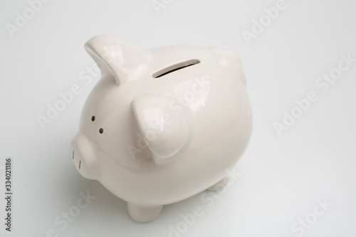 A white piggy bank for college, vacation, investments, car, home and rainy day savings