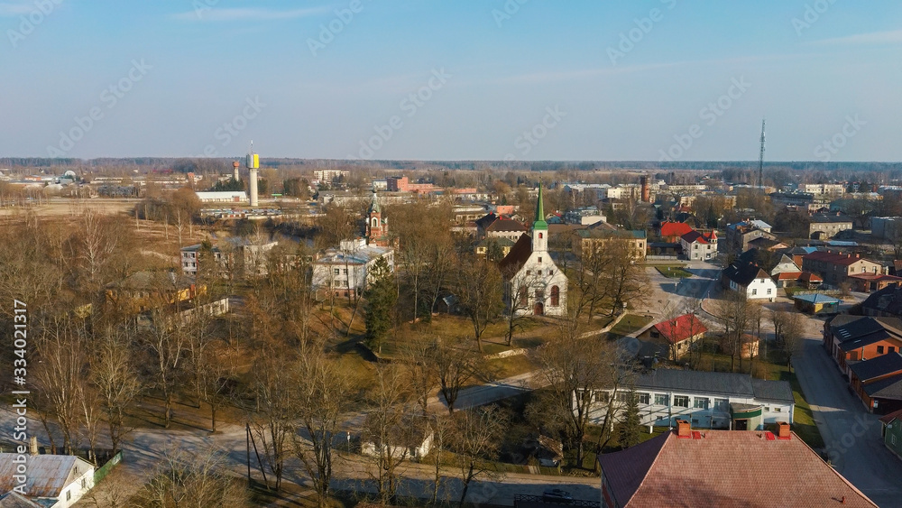 Latvia, Limbazi Medieval Castle Ruins. Aerial View of the 13 Th Century Castle. Stone Ruins With New Created High Observation Tower. Church and City in Background Latvia, Limbazi Medieval Castle Ruins. Aerial View of the 13 Th Century Castle. Stone Ruins With New Created High Observation Tower. Church and City in Background