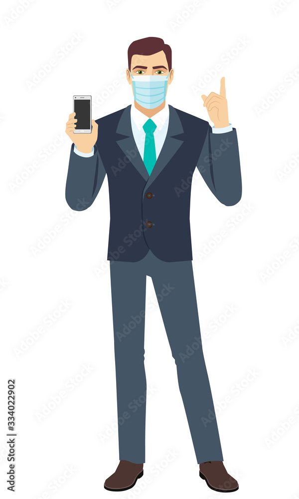 Businessman with medical mask holding mobile phone and pointing up. Full length portrait of Businessman in a flat style. Businessman with medical mask holding mobile phone and pointing up. Full length portrait of Businessman in a flat style.