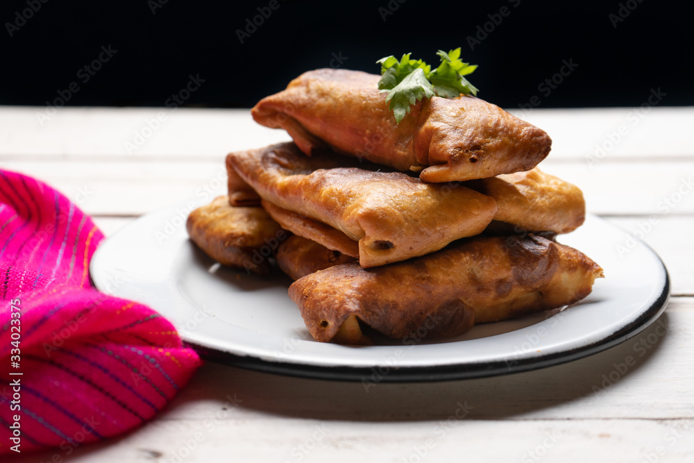 Mexican chimichanga on white background Mexican chimichanga on white background