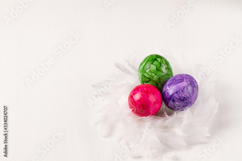 Easter eggs on white background. Colorful easter eggs in the nest