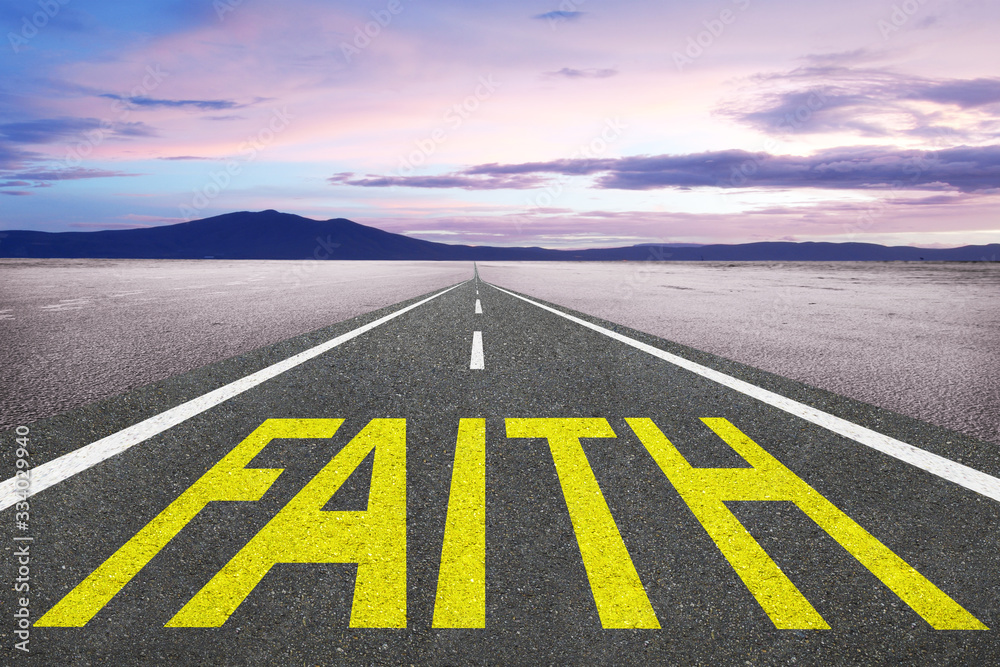 Faith word written on road of life for trust and spirituality concept.