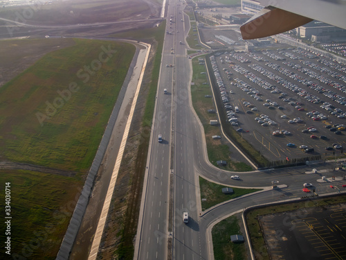 From plane window road and auto park view