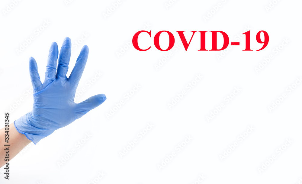 Hand in blue medical glove, five fingers, palm open hand. Medicine, hygiene, virus protection and COVID-19 coronavirus pandemic concept. Copy space. Place for your text Hand in blue medical glove, five fingers, palm open hand. Medicine, hygiene, virus protection and COVID-19 coronavirus pandemic concept. Copy space. Place for your text
