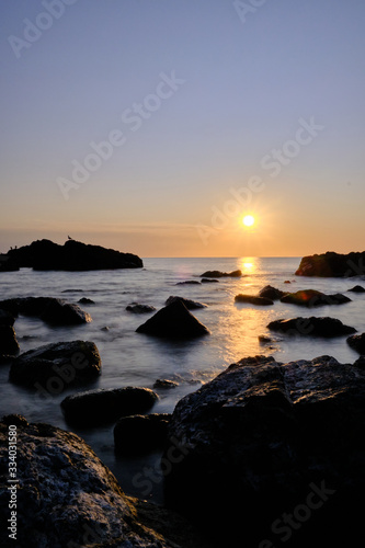 the sunset at the background in the atlantic ocean, Punta Ballena, Maldonado, Uruguay