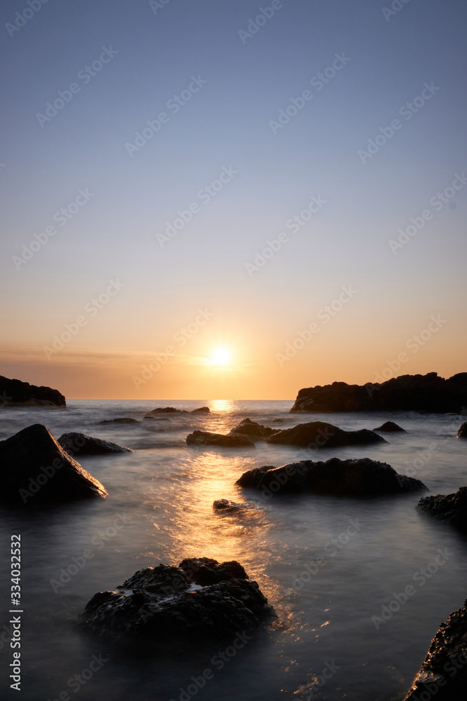 the sunset at the background in the atlantic ocean, Punta Ballena, Maldonado, Uruguay