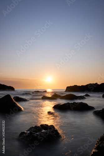 the sunset at the background in the atlantic ocean, Punta Ballena, Maldonado, Uruguay © Leandro