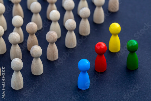 Personal development. Wooden figure in a crowd. Think different.