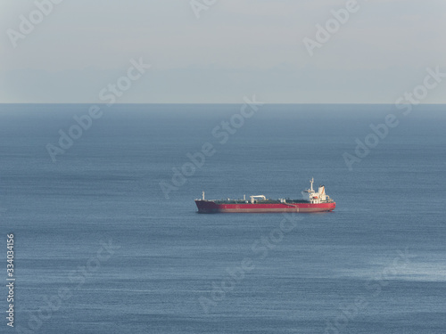 empty oil tanker alone in the middle of calm ocean