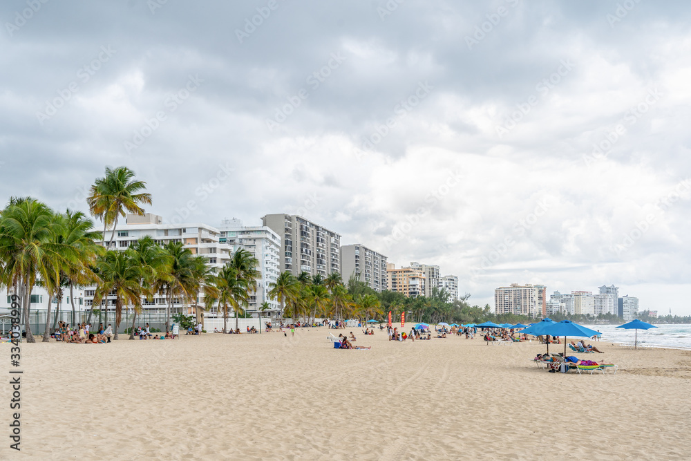 Isla Verde, Puerto Rico - March 29, 2019: Beach-goers Enjoying the Beautiful Beaches of Isla Verde, Puerto Rico.