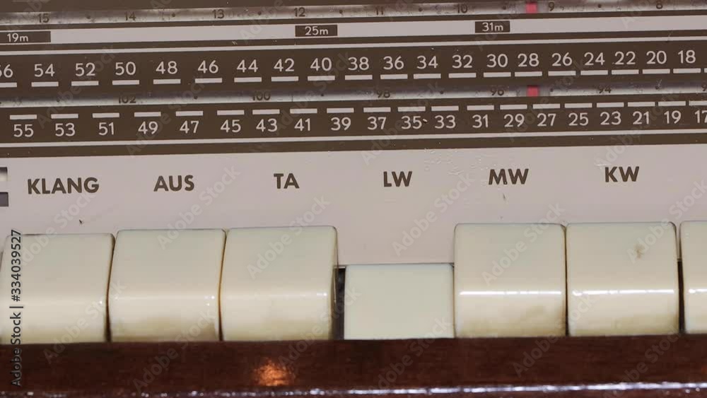 Tuning Analog Radio Dial Frequency on Scale of the Vintage Receiver. Radio frequency receiver Tuning Analog Radio Dial Frequency on Scale of the Vintage Receiver. Radio frequency receiver