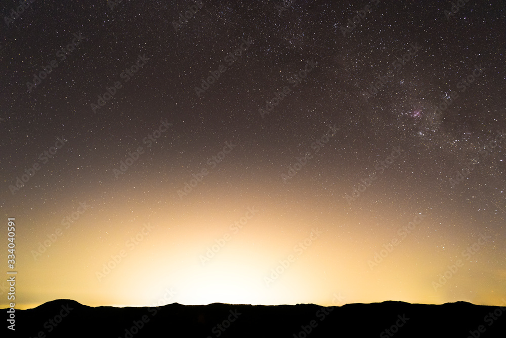 Panorama photo of  the Milky Way over the Blue Mountains, illuminated by the light pollution of Sydney