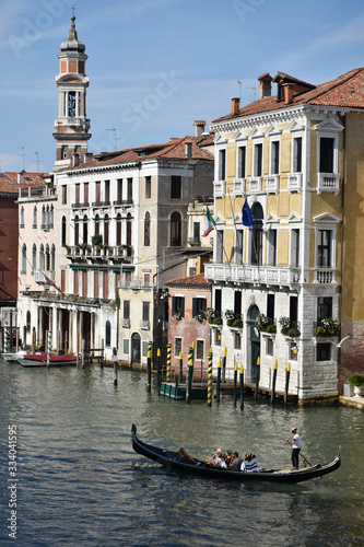 Venice canal with buildings on background and only one gondola on the water  © Jon Fonte