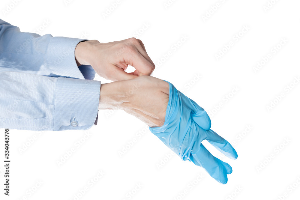 office manager put on blue latex gloves, closeup. office manager put on blue latex gloves, closeup.